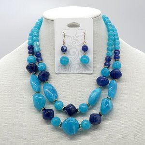 Water drop acrylic pendants necklace with matching earrings.